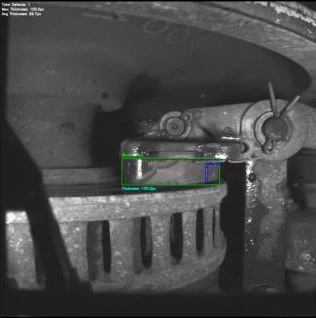 The final panel with pad, defect and thickness markings mapped back to the original frame, including summary text.